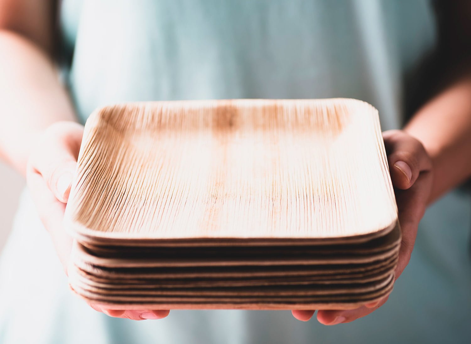 Holding biodegradable cutlery from areca palm leaves